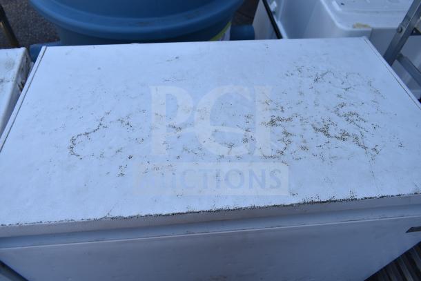 2 Magic Chef HMCF5W4 chest freezers, 115 volts, 1 phase, shows wear. Ideal for storage needs. Auction includes both units.