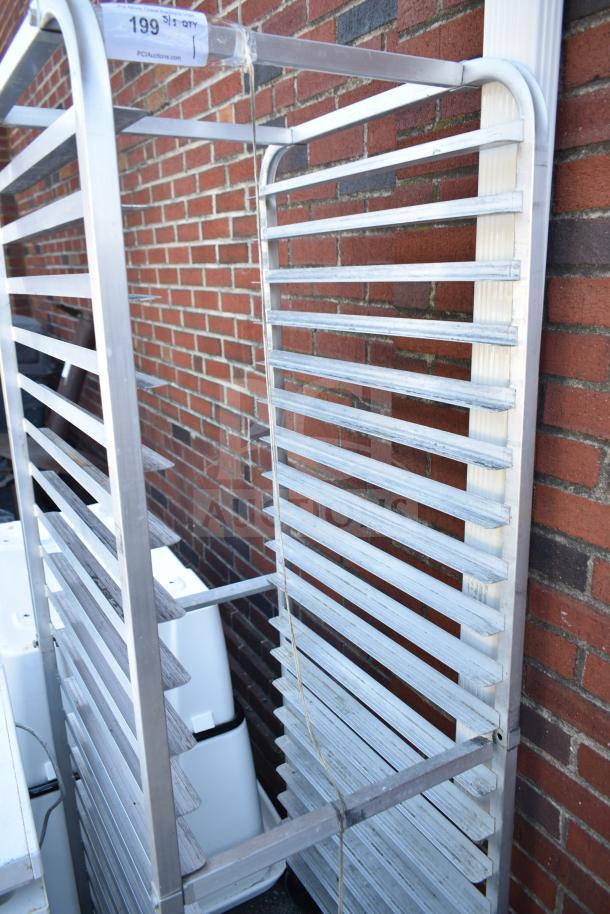 Commercial pan transport rack with metal shelves and commercial casters; sign shows item number 199.