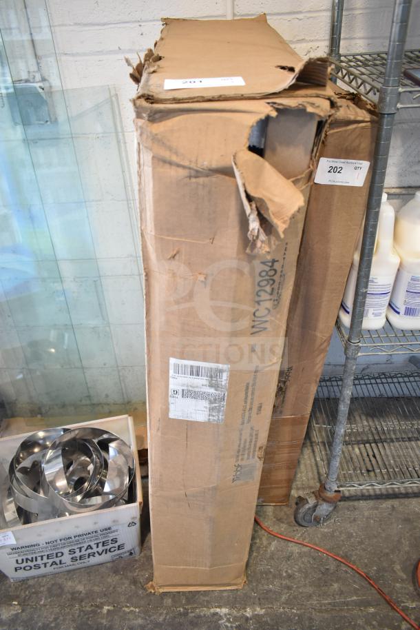 Brand new scratch and dent WC12984 sit-to-stand return, 42"W x 24"D, packaging damaged, item condition unknown.