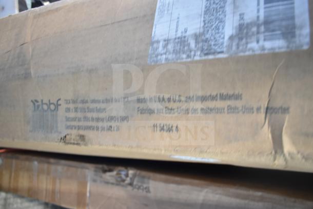 Cardboard box label for WC12984 42W x 24D Sit to Stand Return, brand new with minor scratches and dents, made in USA.