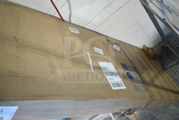 Brown cardboard box labeled "WC12977C2 Unit," showing signs of scratches and dents, with shipping labels attached.