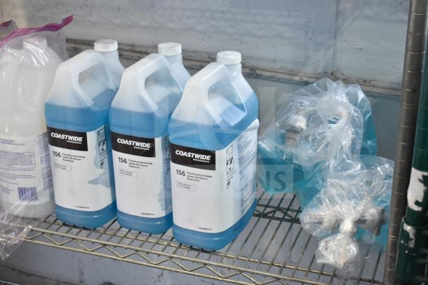 Auction lot featuring Coastwide foaming hand soap bottles on a metal shelf; Diversey Wiwax ProX emulsion and espresso beans not shown.