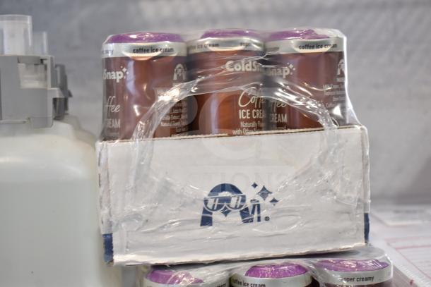 Three-tier lot including Coastwide Foaming Hand Soap, Diversey Wiwax ProX Emulsion, and espresso beans. No shelving unit included.