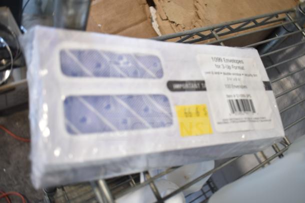 Three-tier lot including Coastwide Foaming Hand Soap, Diversey Wiwax ProX Emulsion, espresso beans; no shelving unit included.