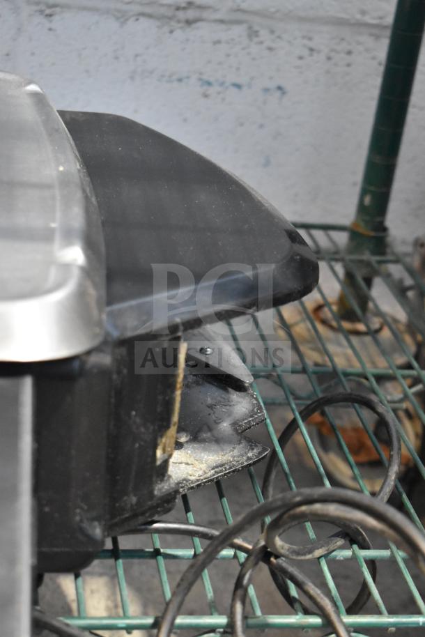 2016 Hobart HTi-7LH commercial food portioning scale, showing side and part of cord, metal and black finish.