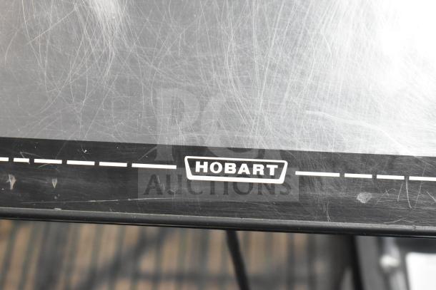 2017 Hobart HTi-7LH26 countertop scale, 120/208-240V, 1-phase; tested, non-functional. Visible Hobart logo, scratched surface.