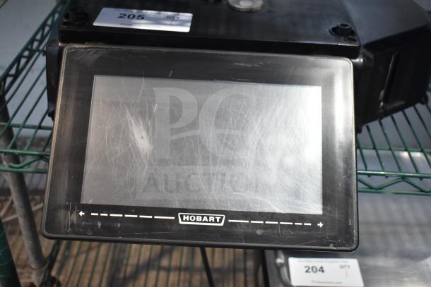 2017 Hobart HTi-7LH26 commercial scale, scratched, black, not powering on. Model on display; 120/208-240V, 1 phase.