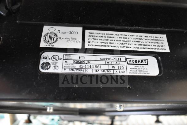 2016 Hobart HTi-7LH commercial scale label showing model, serial number, voltage, and compliance info. No cord included.