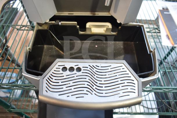 LavAzza 10080632 countertop espresso machine with steam wand, shown open with a removable drip tray. 115 Volts, 1 Phase.