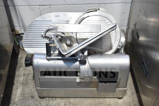 Hobart 1712 Commercial Meat Slicer, 115 Volts, 1 Phase. Stainless steel with manual controls. Slight wear visible.