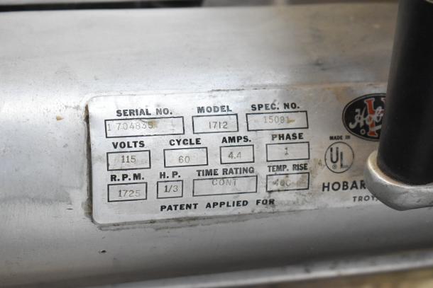 Hobart 1712 Commercial Meat Slicer, 115V, 1 Phase, with visible model and serial number plate, used condition.