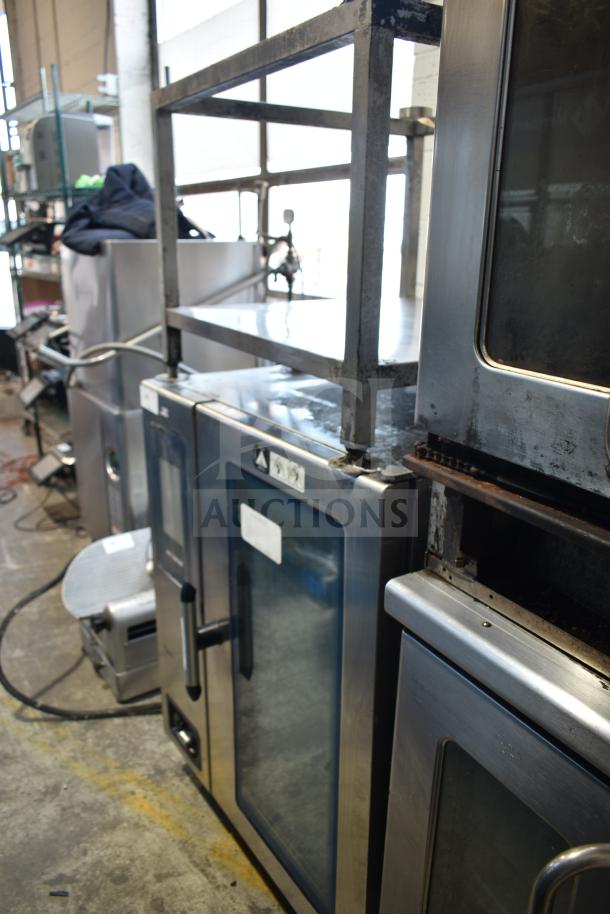 Alto Shaam CTP10-10E stainless steel electric combi convection oven with stand, visible wear, 208/240V, 3-phase.