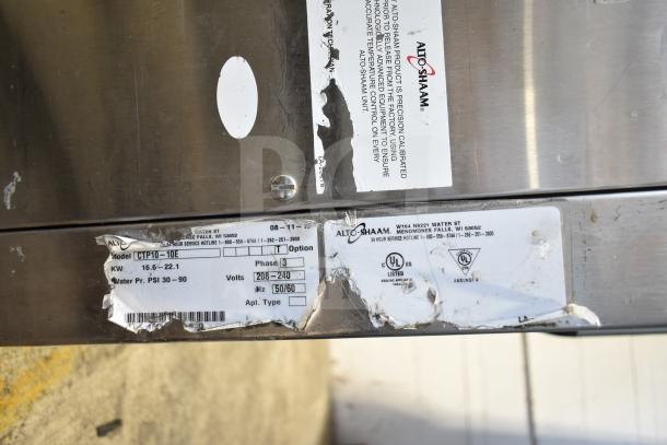 Alto Shaam CTP10-10EVH stainless steel combi oven with equipment stand, 208/240 volts, 3 phase. Labels show model and specifications.