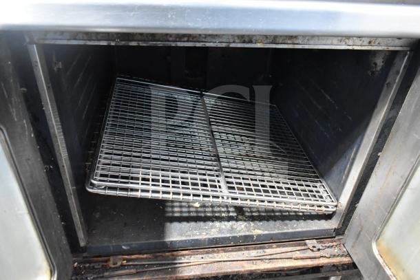 Montague commercial full-size convection oven interior, view-through doors, and racks. Used condition, thermostatic controls.