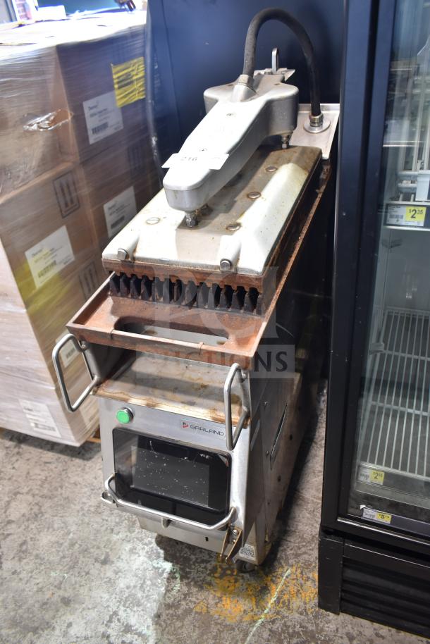 2019 Garland CXPB12 electric clamshell griddle, 208-240V, 3-phase, visible wear, grills showing slight rust, operational panel intact.