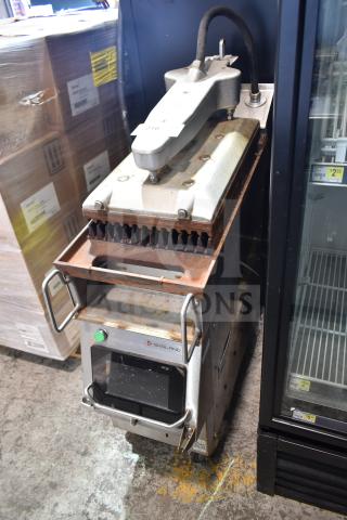 2019 Garland CXPB12 electric clamshell griddle, 208-240V, 3-phase, visible wear, grills showing slight rust, operational panel intact.