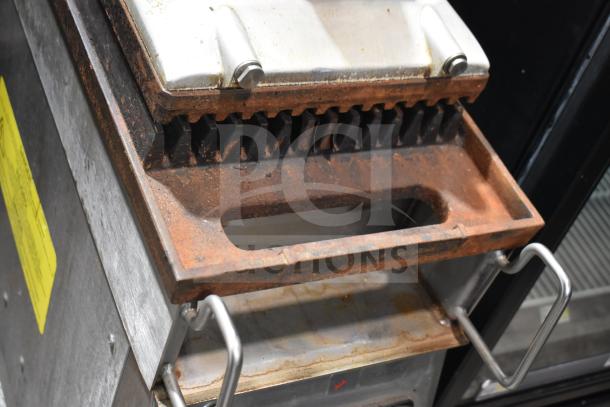2019 Garland CXPB12 electric clamshell griddle, 208-240V, 3 phase, shows rust on cooking area, used condition.