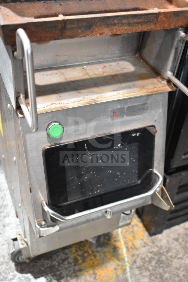 2019 Garland CXPB12 electric clamshell griddle, stainless steel, visible wear, 208-240V, 3-phase. Garland logo on front.