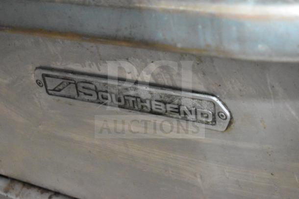 Southbend P48D-BBBB commercial gas range nameplate, stainless steel, with visible branding and slight surface wear.
