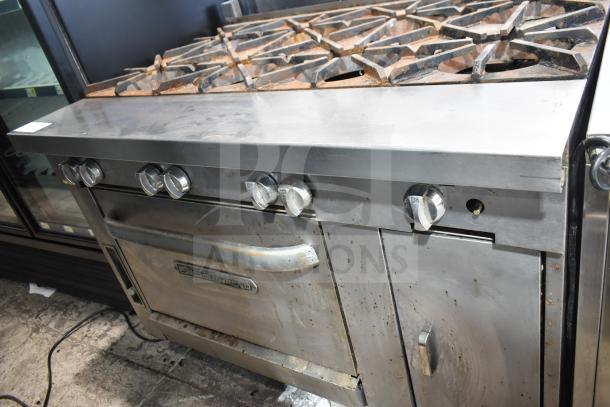 Southbend P48D-BBBB commercial range with 8 burners, oven, on casters. Natural gas, stainless steel, used condition.