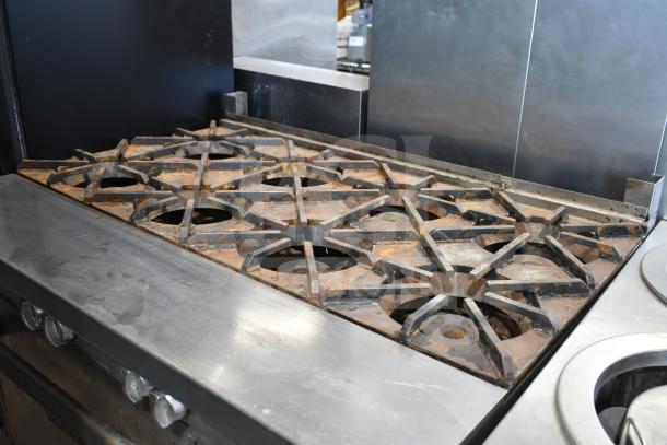 Southbend P48D-BBBB commercial 8 burner natural gas range with oven, features wear and commercial casters.