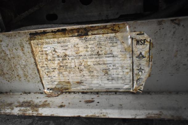 Southbend P48D-BBBB 8 burner range, natural gas, with oven, commercial casters. Worn label with specs and NSF mark visible.