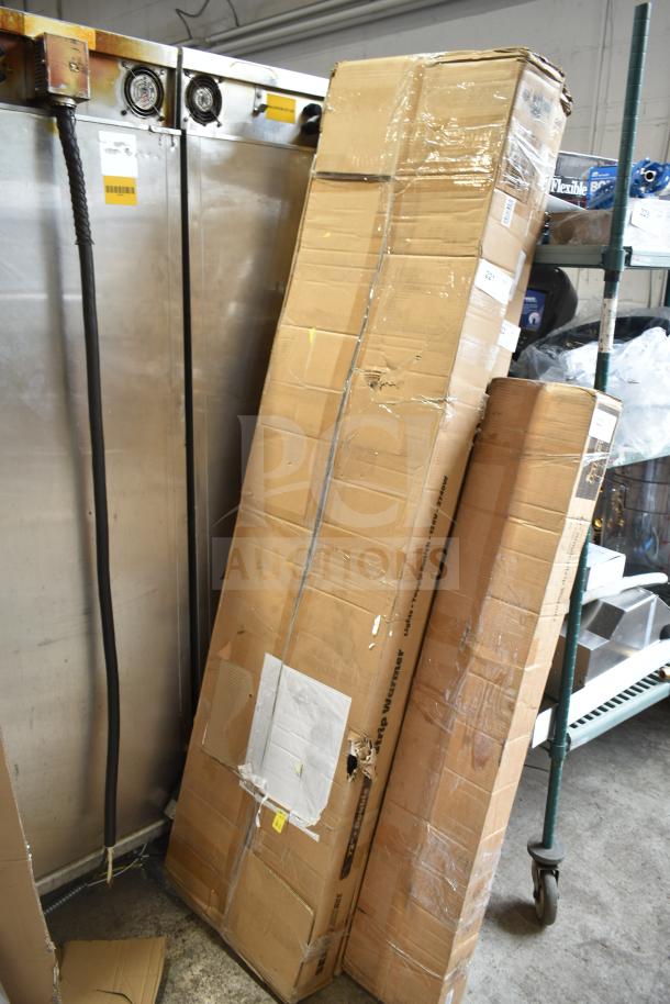 Cardboard box containing a 2025 ServIt 423SW72TLHDBLA 72" Lighted Double Strip Warmer, new with minor scratches. Dual toggle controls, 120V.