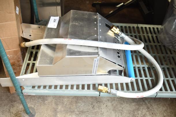 BRAND NEW SCRATCH AND DENT! The Boss Shortening Shuttle Handle, metal construction, visible hoses, dented surface, marked with manufacturer details.