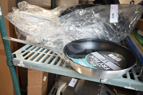 6 new 12" Choice non-stick aluminum fry pans, model 407FRYPANS12, with minor scratches.