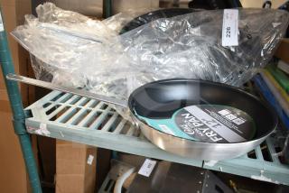 6 new 12" Choice non-stick aluminum fry pans, model 407FRYPANS12, with minor scratches.