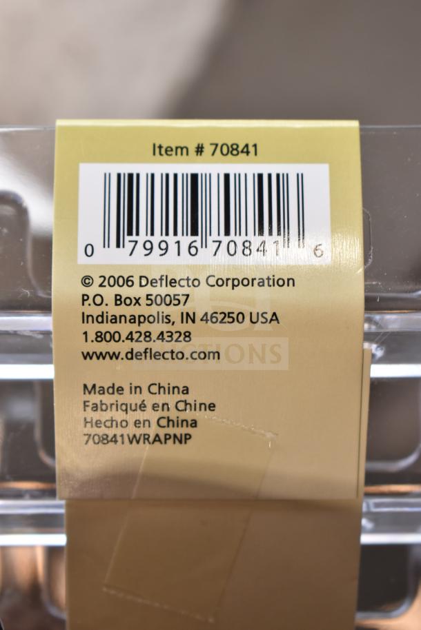 Clear plastic 4-pocket business card holder by Deflecto, Item #70841, made in China, with barcode and contact info.