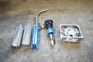 Five new scratch and dent items including metal cylinders, a blue grip tool, and accessories in a box labeled "228."