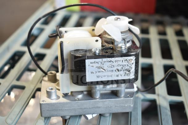 "Avantco 177PRGMTR2 motor for hot dog roller grills, new condition, 120V, visible wiring and label on side."