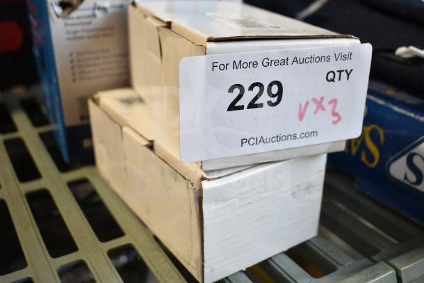 Stack of sealed boxes labeled "229 QTY x3," containing Avantco 177PRGMTR2 motors for hot dog roller grills, PCI Auctions branding.