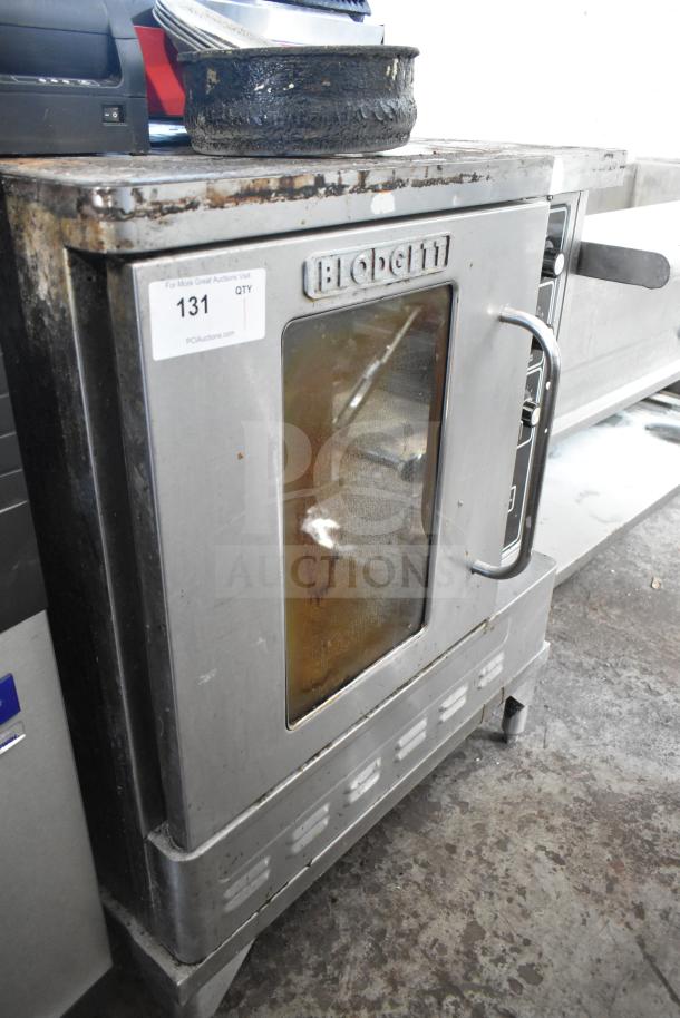 Blodgett gas convection oven with view-through door, thermostatic controls. Visible wear, oven model label, item tag 131.