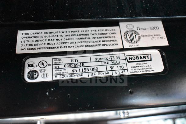 2016 Hobart HTi-7LH Commercial Scale label showing model number, voltage, and compliance markings.
