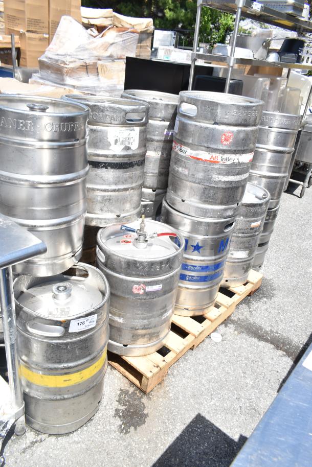 10 assorted metal kegs, including half-size barrels, with visible AB InBev and MicroStar labels, on a pallet.