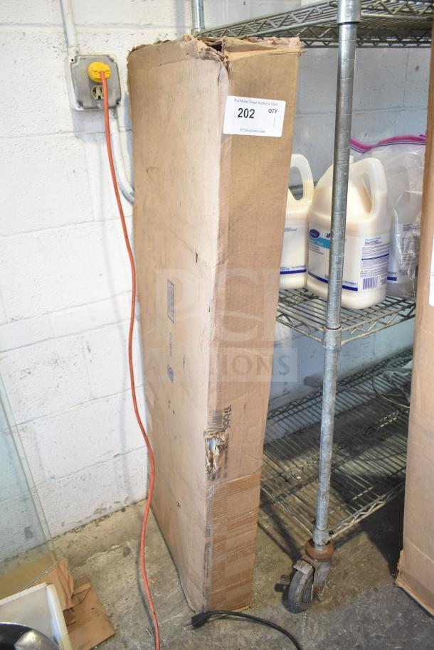 Cardboard box containing scratch and dent panels, labeled WC12977C2 W134362 851393. Box slightly damaged. Auction label with quantity 202.