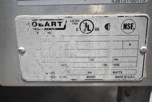 Hobart AM15 commercial corner pass-through dishwasher, showing model and serial number on manufacturer label. 208-240V, 3 phase.