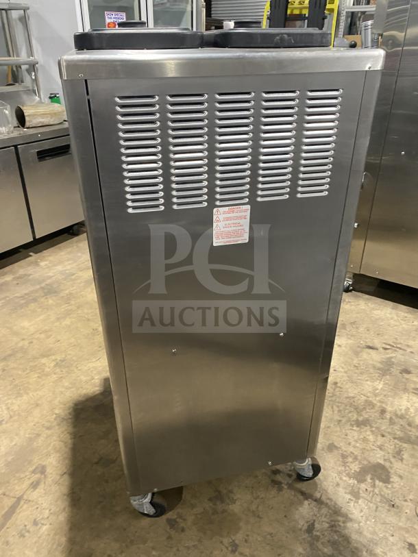 Taylor Dunkin Donuts style stainless steel double flavor frozen drink machine, model 342D-27, on casters.