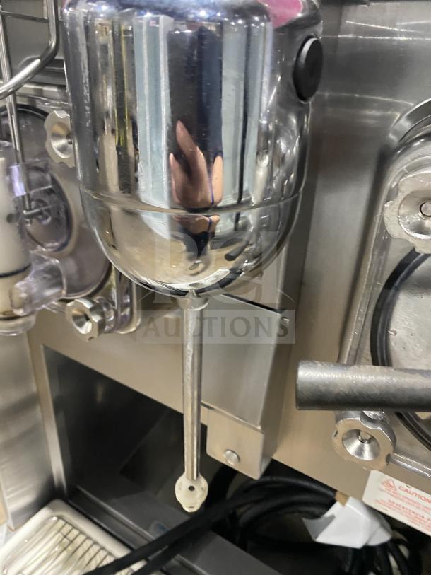 Taylor stainless steel double flavor frozen drink machine, model 342D27, in good condition. Features 208-230V, 1 Phase, on casters.