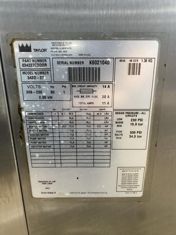 Taylor 342D-27 stainless steel frozen drink machine, SN: K6021040, 208-230V, 1 Phase, on casters, dual flavor.