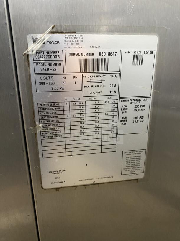 Taylor 342D-27 stainless steel floor-standing dual-flavor frozen drink machine, model 342D-27, serial K6018647, on casters.