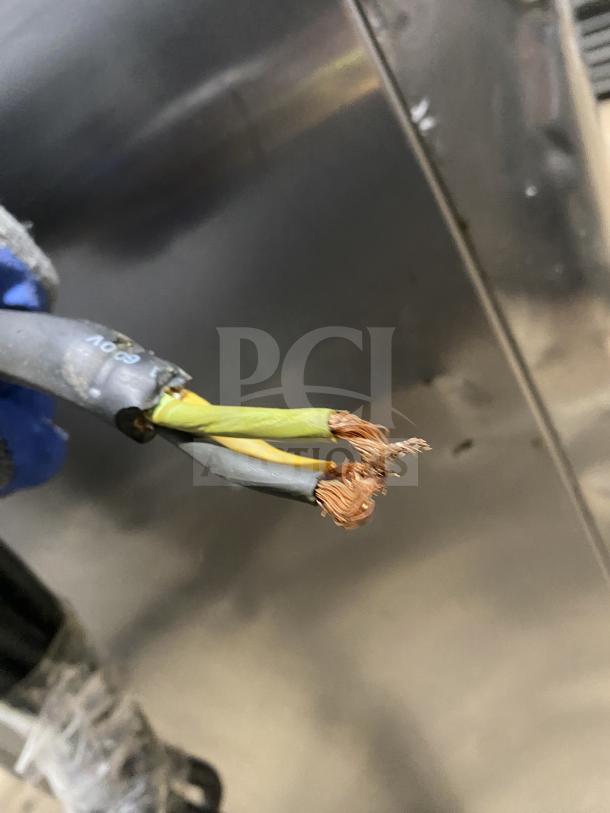 Close-up of exposed electrical wiring for the Taylor 342D-27 frozen drink machine. Damaged insulation visible.