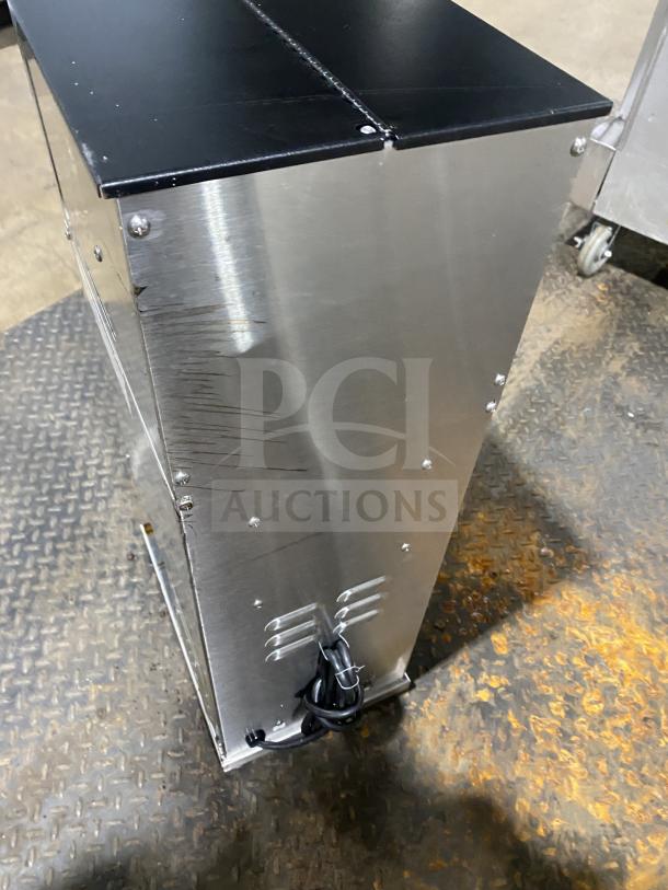 Curtis ILGD-10 stainless steel coffee grinder, twin 7.5 lb capacity, 120V. Minor surface scratches, commercial use.