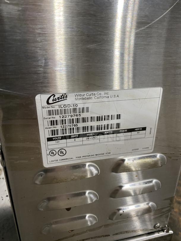 Curtis ILGD-10 stainless steel coffee grinder, 7.5 lb capacity, serial number 12279765, 120V, single phase, good condition.