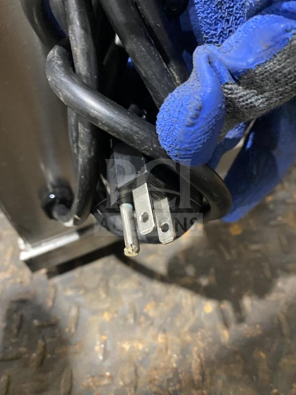 Curtis ILGD-10 coffee grinder, 7.5 lb capacity, stainless steel, 120V, in used condition; power cord shown.