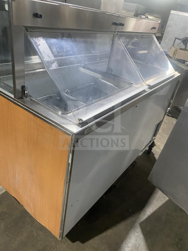 Beverage-Air 68" white ice cream dipping cabinet with sneeze guard, dual rear lift doors, minor wear visible.