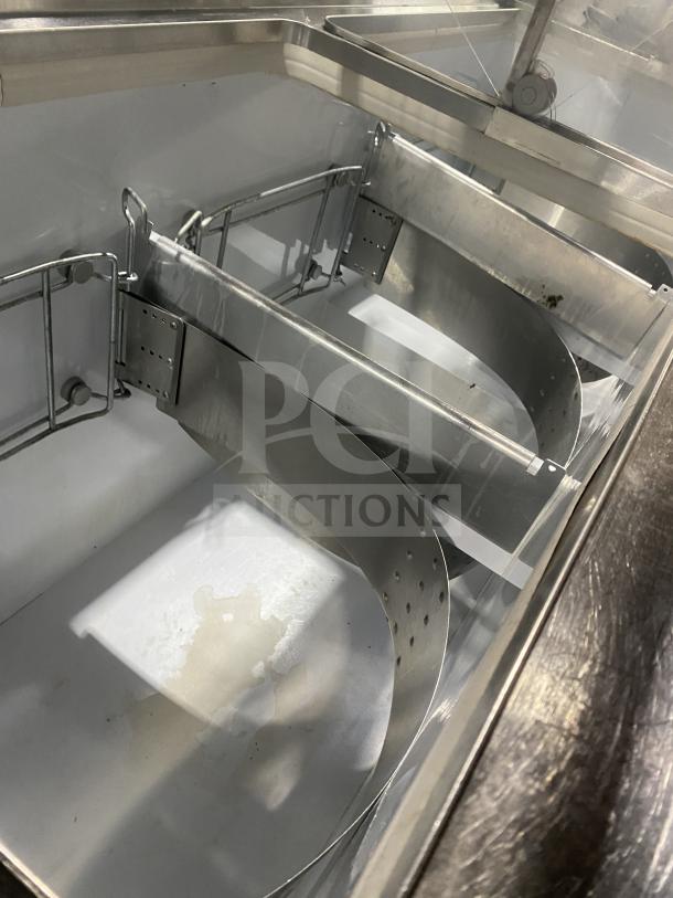 Beverage-Air 68" white ice cream dipping cabinet, Baskin Robbins style, with sneeze guard and rear lift doors, interior view.