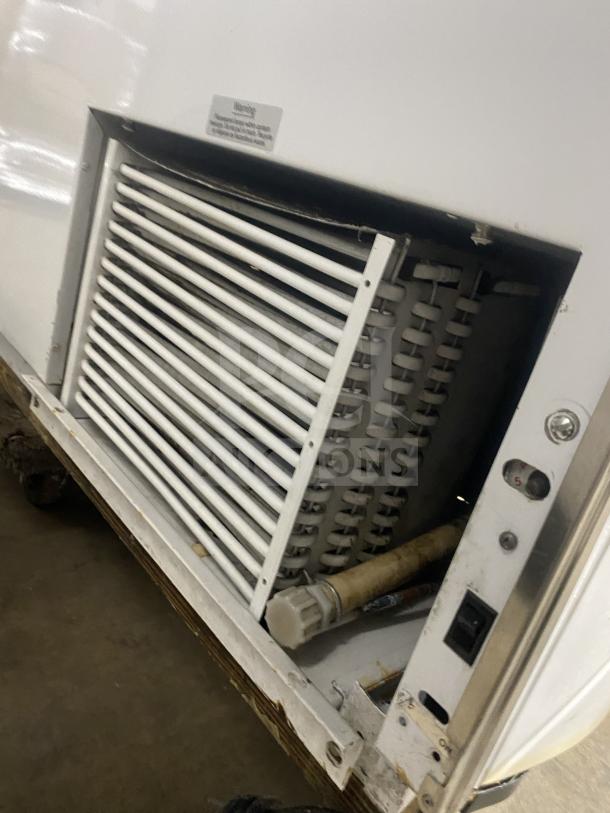 Beverage-Air 68" commercial ice cream cabinet, white with rear double doors, sneeze guard, visible vent and controls.